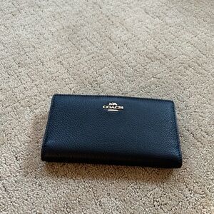 Coach Slip Zip Wallet. NWOT. Black with gold zipper.